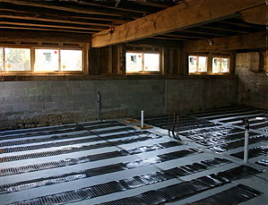 Electric floor heating system being installed.